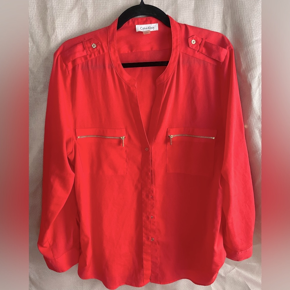 Extra large Calvin Klein women’s orange button up blouse.